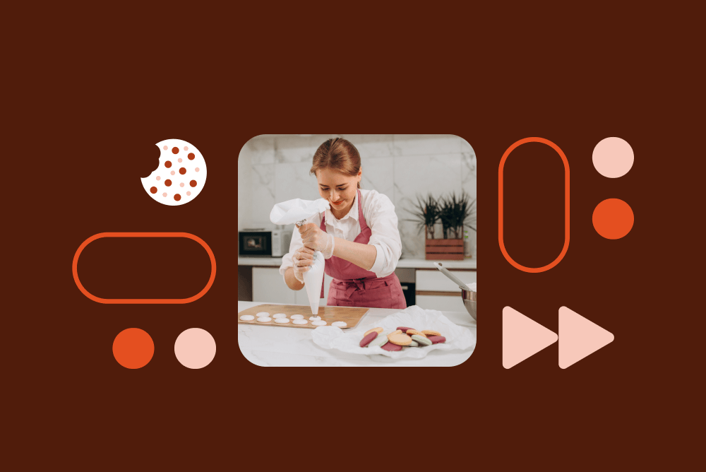 Baker in pink apron decorating cookies with piping bag in kitchen, surrounded by geometric shapes on brown background